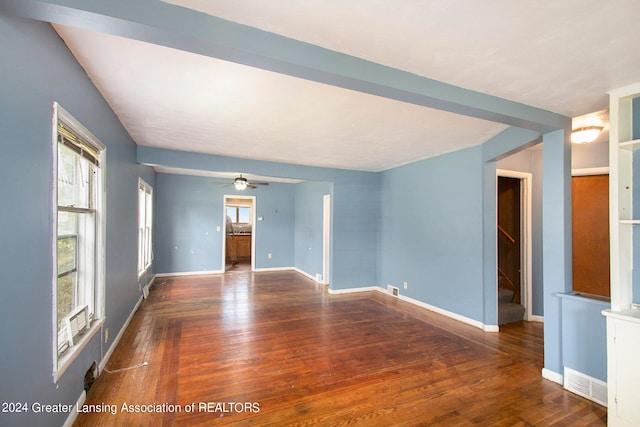 unfurnished room with ceiling fan and dark wood-type flooring