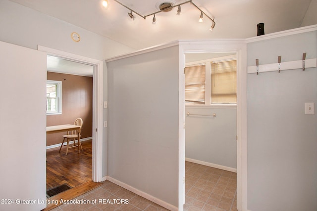 hall with hardwood / wood-style floors