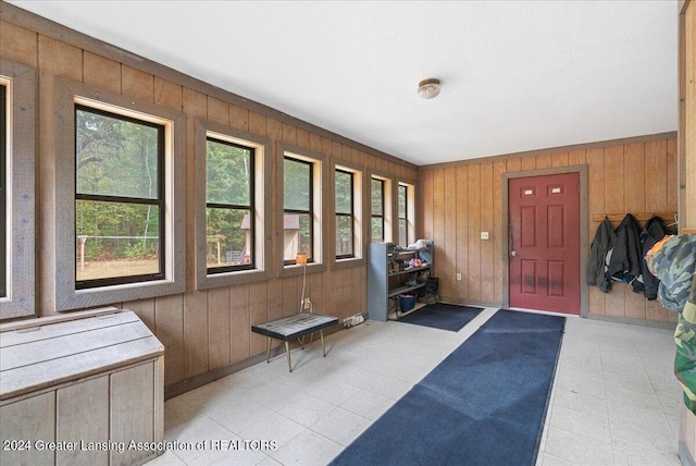 foyer entrance with wood walls