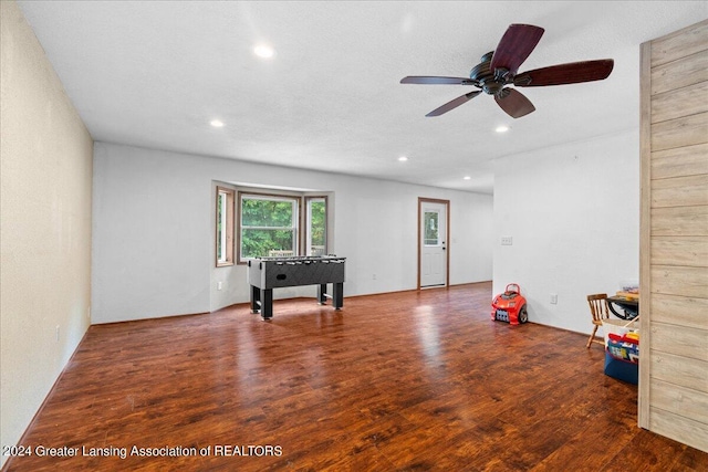 interior space with ceiling fan and dark wood-type flooring