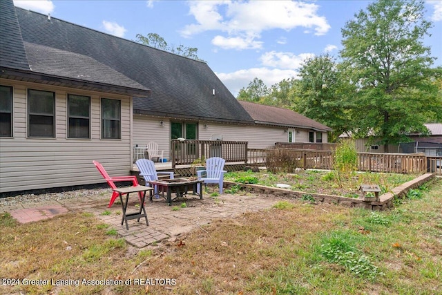 view of yard featuring a patio and an outdoor fire pit