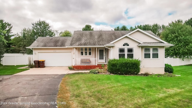 single story home with a front yard and a garage