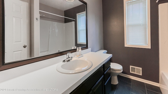 full bathroom featuring shower / tub combination, vanity, tile patterned flooring, and toilet