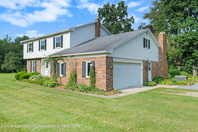 front facade featuring a front yard and a garage