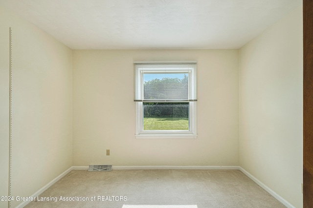 empty room with carpet flooring