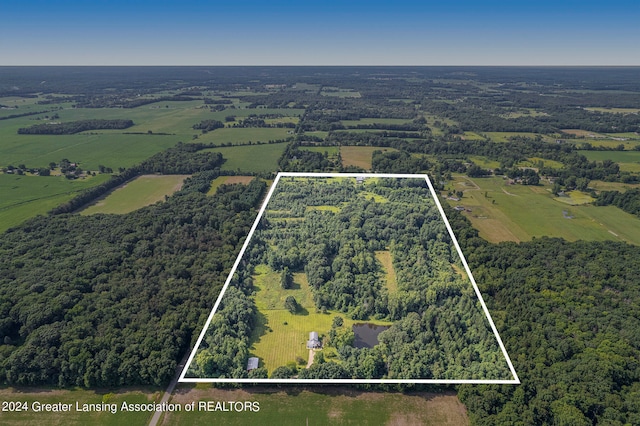 birds eye view of property with a rural view