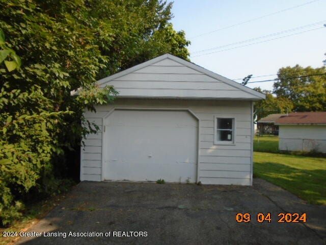 garage with a yard