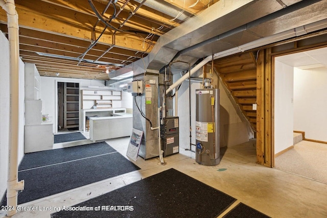 basement featuring gas water heater and heating unit