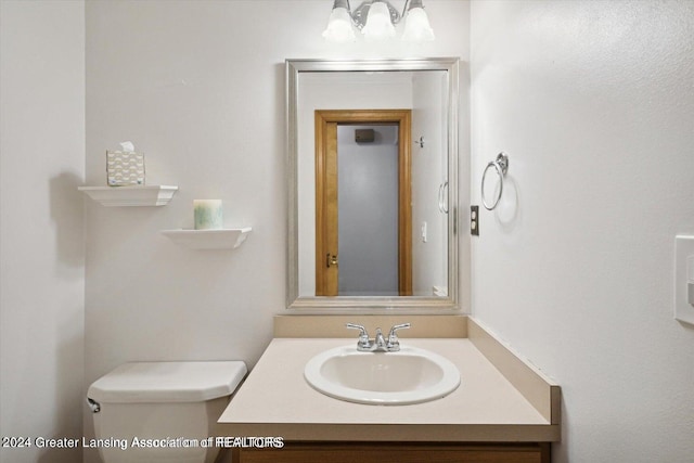 bathroom with vanity and toilet