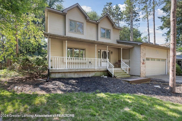 view of front of home featuring covered porch and a garage