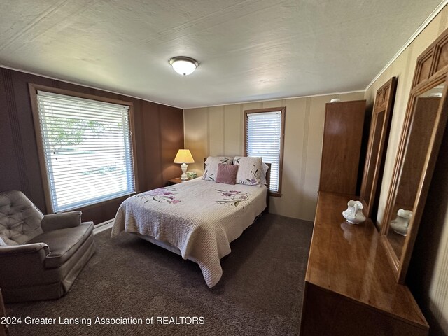 carpeted bedroom featuring a textured ceiling