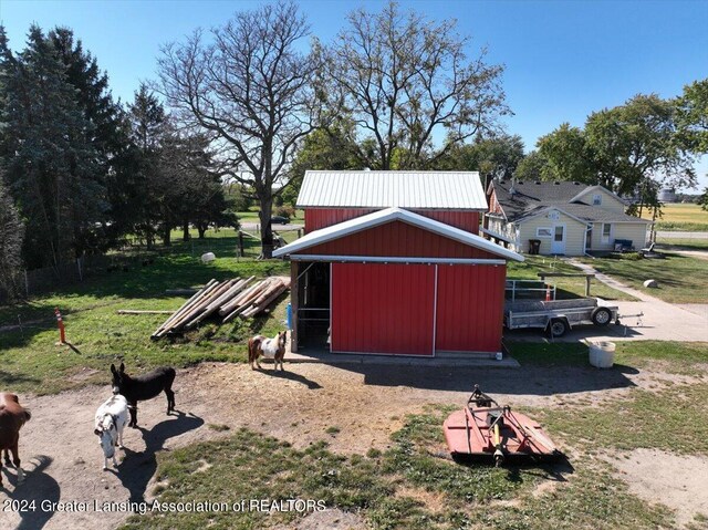 view of outdoor structure featuring a lawn