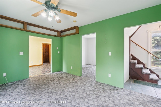 empty room with light carpet and ceiling fan