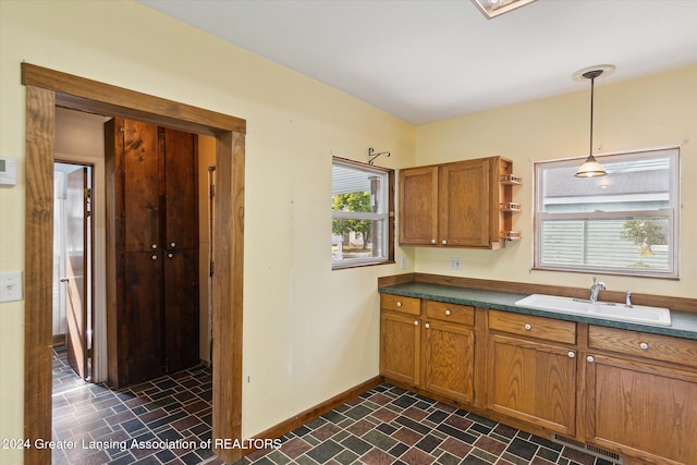 kitchen with sink and hanging light fixtures