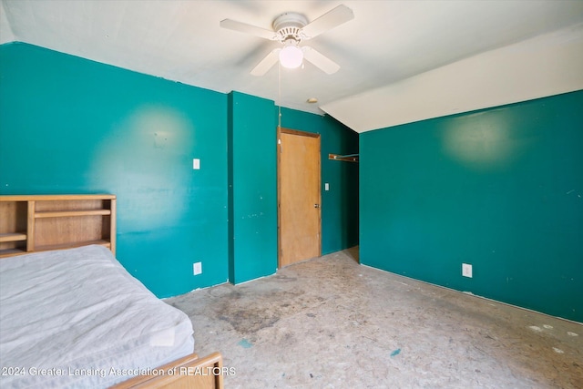 unfurnished bedroom featuring ceiling fan and lofted ceiling