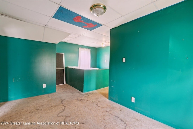 empty room with a drop ceiling