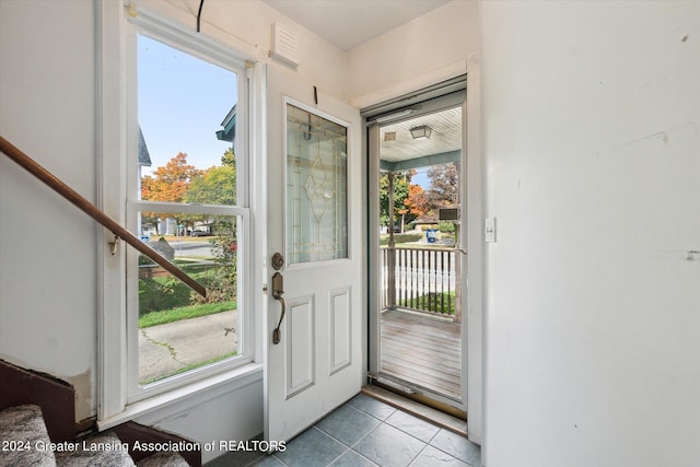 entryway featuring light tile patterned floors and a wealth of natural light