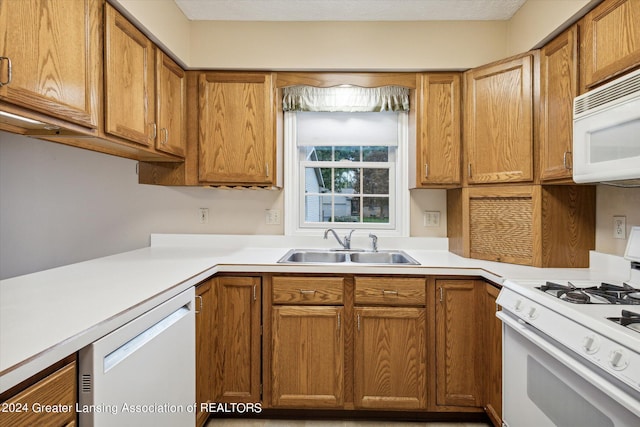 kitchen with white appliances and sink