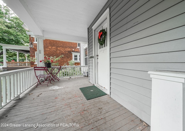 wooden deck featuring covered porch