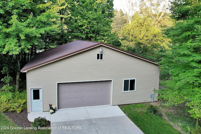 view of property exterior with a garage