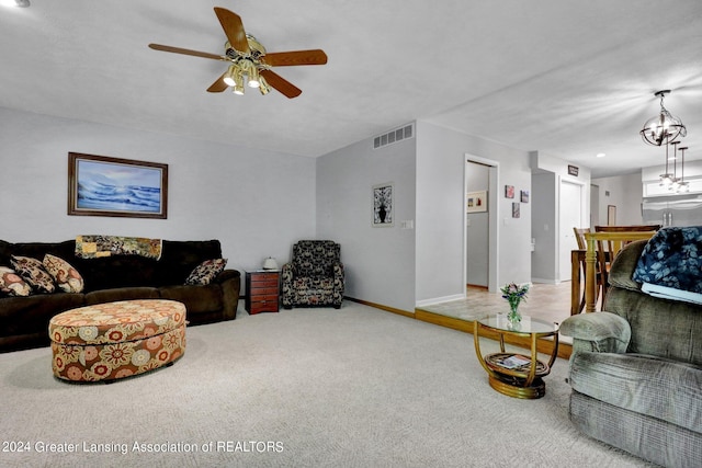 living room featuring ceiling fan and carpet floors