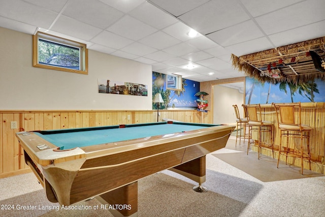 playroom featuring a paneled ceiling, carpet floors, wooden walls, and pool table