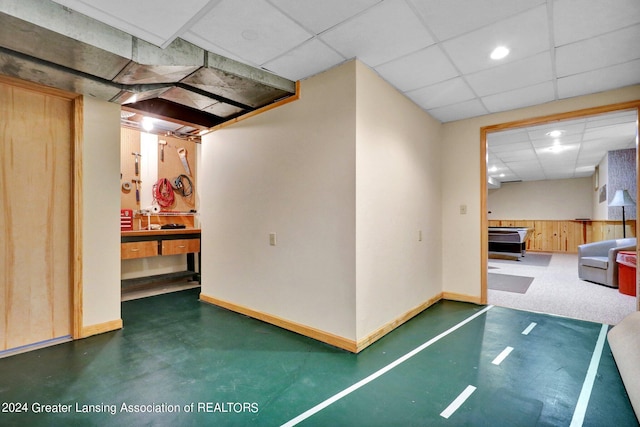 basement featuring a drop ceiling