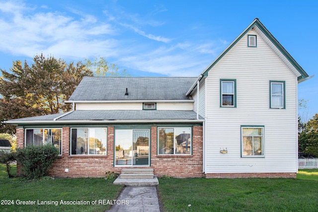 318 S Shiawassee St, Corunna, MI 48817 - rear view of property with a lawn, roof with shingles, and brick siding