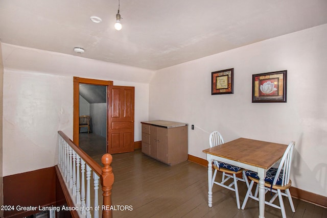 dining area with dark hardwood / wood-style flooring