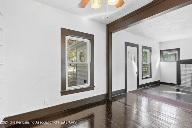 entrance foyer with a textured ceiling, dark hardwood / wood-style floors, and ceiling fan