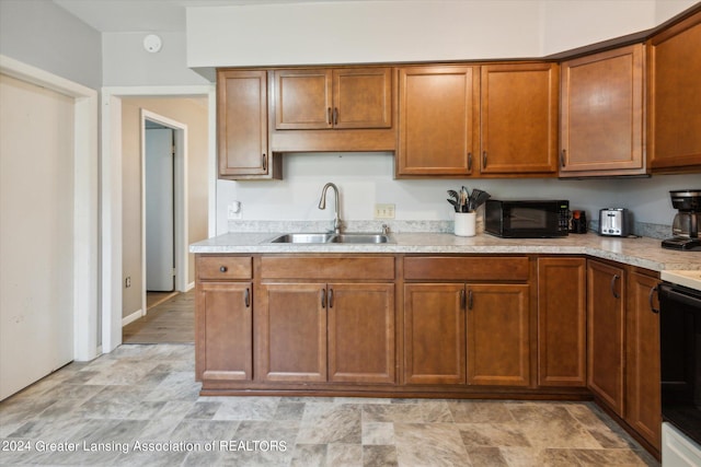 kitchen featuring black appliances and sink