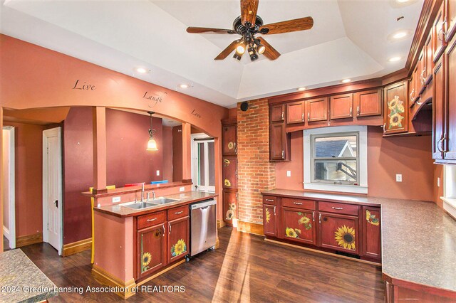 kitchen featuring sink, dishwasher, a raised ceiling, dark hardwood / wood-style flooring, and hanging light fixtures