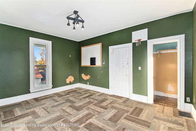 unfurnished bedroom featuring parquet floors