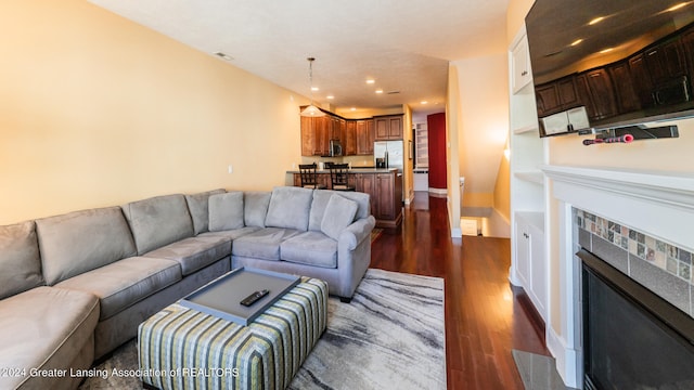 living room featuring dark hardwood / wood-style flooring