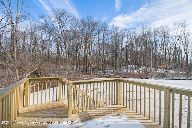 view of snow covered deck