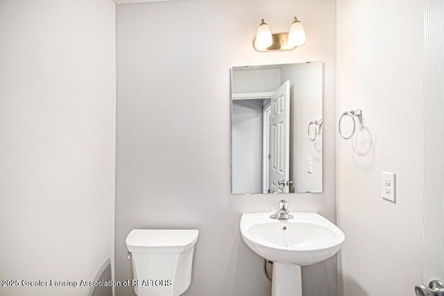 bathroom with sink and toilet