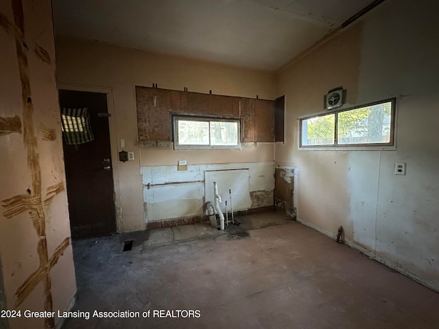 miscellaneous room featuring concrete floors and plenty of natural light