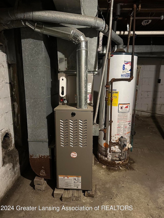 utility room featuring gas water heater