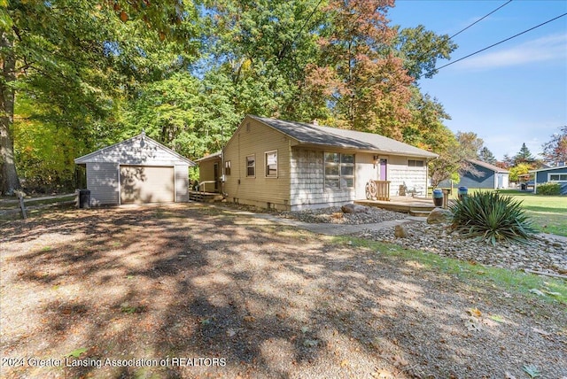 exterior space featuring an outbuilding and a garage