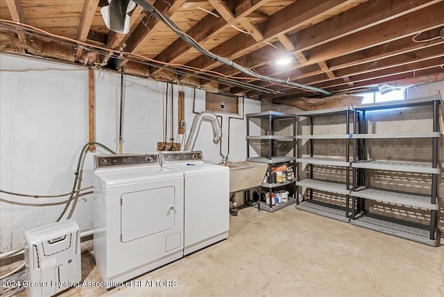 basement with washing machine and clothes dryer