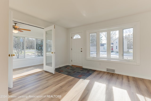 entrance foyer with wood-type flooring and ceiling fan