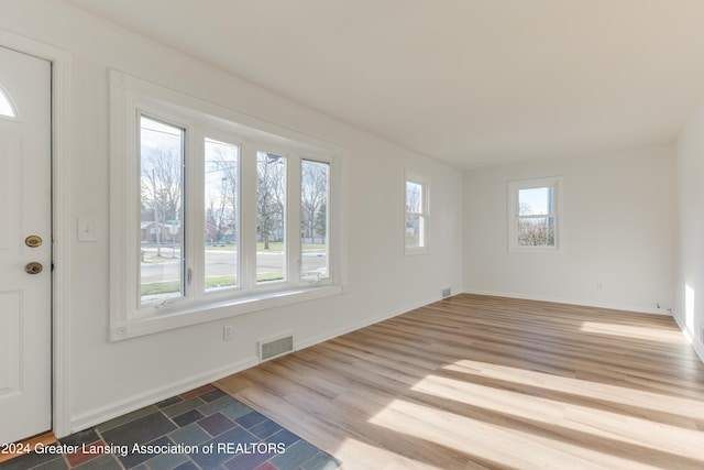 unfurnished room featuring hardwood / wood-style flooring