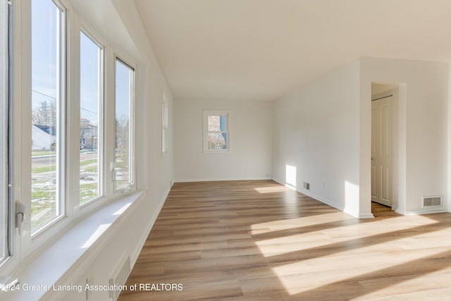 unfurnished room featuring light hardwood / wood-style flooring