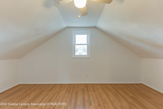 additional living space with ceiling fan, light hardwood / wood-style flooring, and lofted ceiling