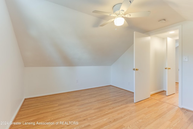 bonus room featuring ceiling fan, light hardwood / wood-style floors, and vaulted ceiling