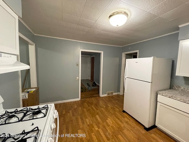 kitchen featuring ornamental molding, white cabinetry, exhaust hood, white appliances, and light hardwood / wood-style flooring