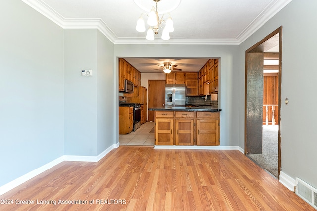 kitchen with tasteful backsplash, light hardwood / wood-style floors, appliances with stainless steel finishes, and ornamental molding