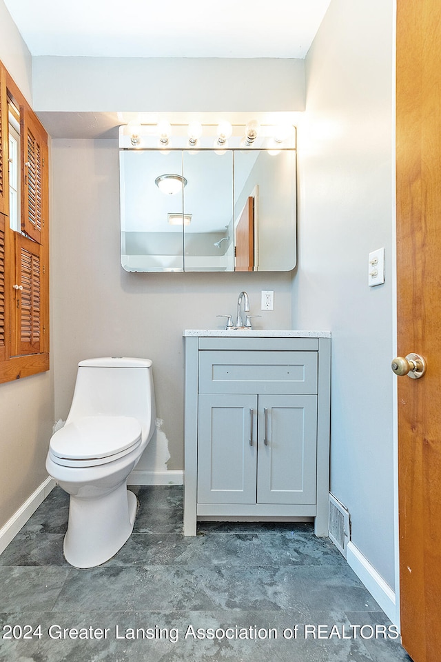 bathroom with vanity and toilet