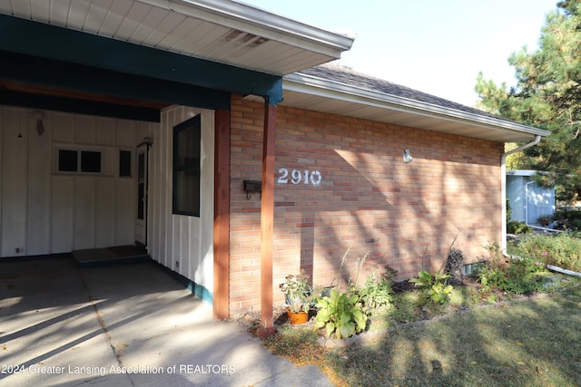 view of property exterior with a carport