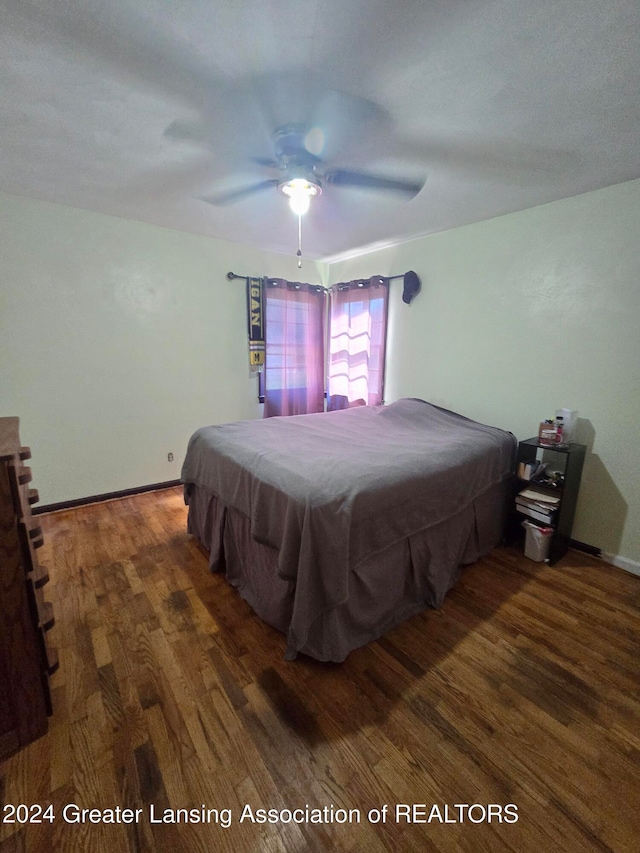 bedroom featuring ceiling fan, billiards, and dark hardwood / wood-style floors